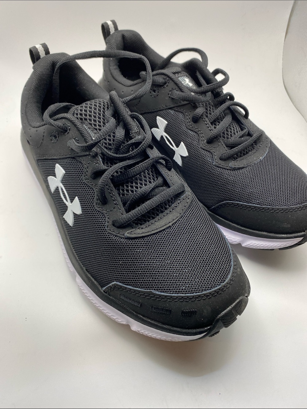 Under Armour Black and White Youth Athletic Sneakers